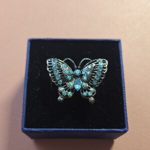 Elegant Silver Butterfly Brooch with Blue Accents
